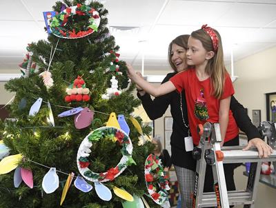 Local students help decorate town hall tree
